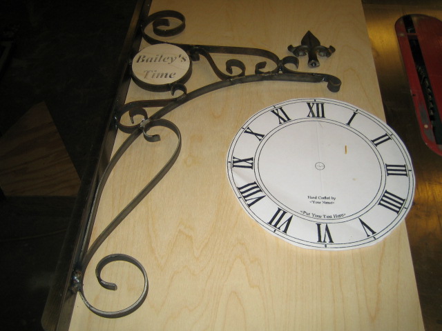 wart , baileys clock, wrought iron frames 001.JPG