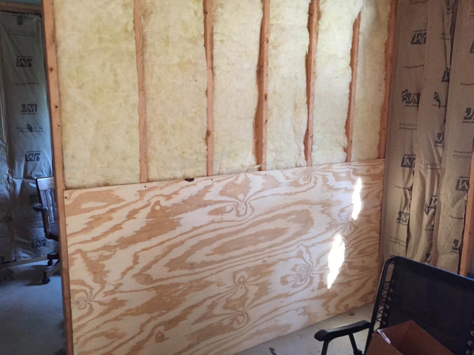 Insulation and wall covering in storage room.jpg